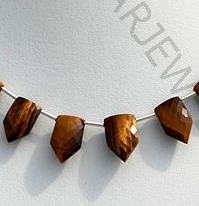 Tiger eye gemstone pentagon shape beads.