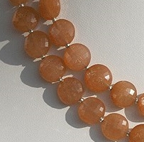 Orange moonstone faceted coin