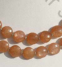 Orange moonstone faceted coin
